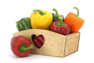 Wooden box full of bell peppers