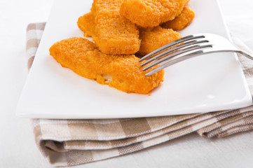 Fried fish sticks. Bastoncini di pesce.