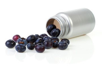 Conceptual black currant berries as pills