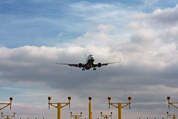 Passenger plane on final approach, with landing lights in view