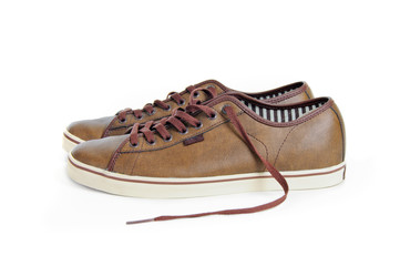 two brown sneakers isolated on white background