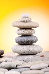 Pebbles stack against gradient background