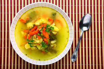 Fresh vegetable soup made of carrot, potato, leek, pea