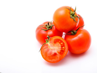 Fresh tomatoes isolated on white