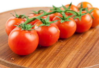 tomatoes on the wood cutting board