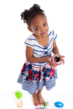 Little African American Girl Eating Chocolate Easter Egg