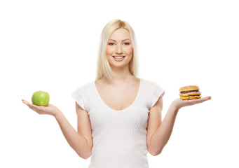 A young blond woman making a decision about food