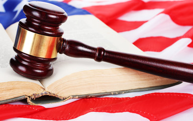 judge gavel and book on american flag background