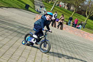 little boy riding his bike