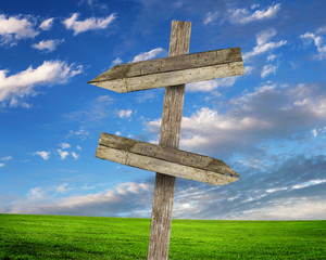Blank road signs against blue sky