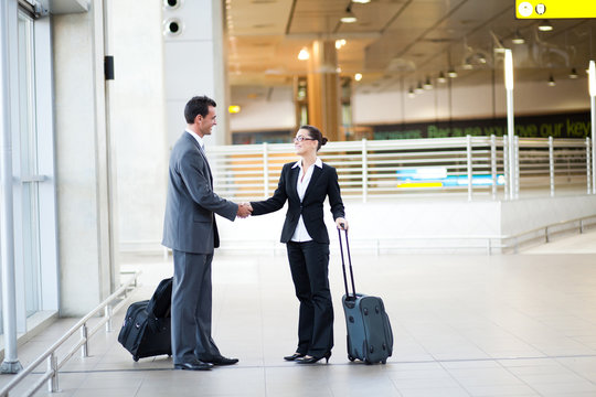 Young Businessman And Businesswoman Meeting At Airport