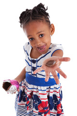 Obraz premium Little african american girl eating chocolate easter egg