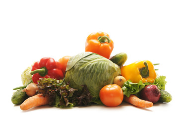 A pile of fresh and tasty fruits and vegetables on white
