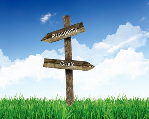 Blank road signs against blue sky