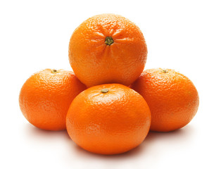 Four fresh and tasty oranges on a white background