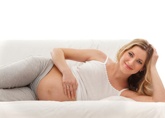 A young and happy pregnant blond Caucasian woman