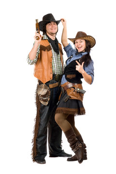 Cheerful young cowboy and cowgirl