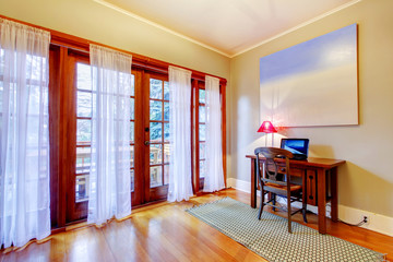 Home office with large door windows.