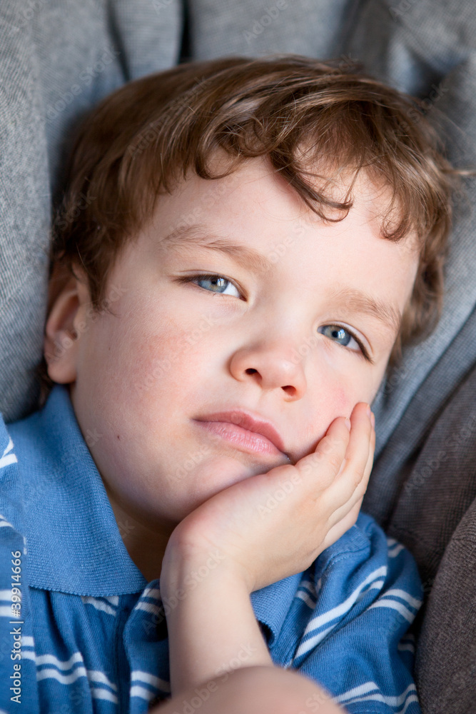 Wall mural Portrait of sad beautiful boy