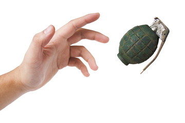 hand throwing a green grenade on white