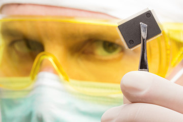 Scientist examining a microchip.