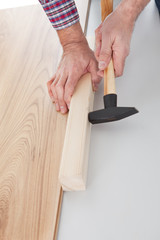 Worker assembling laminate floor