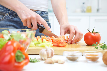 Hands  cooking vegetables salad