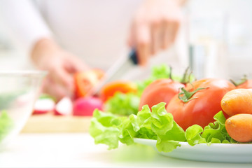 Hands  cooking vegetables salad