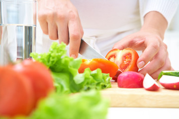 Hands  cooking vegetables salad