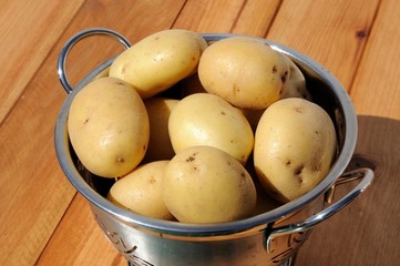 Ceasar potatoes in colander © Arena Photo UK