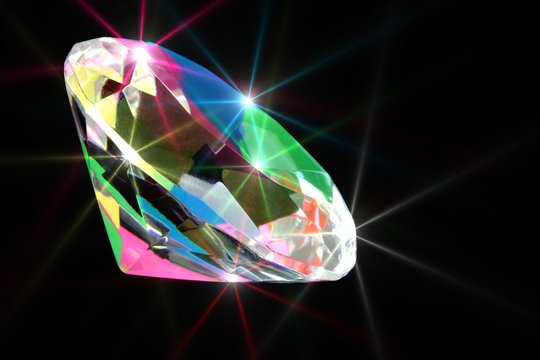 Colorful shining diamond on black background