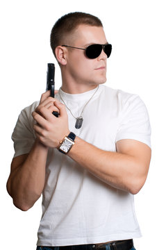 man with gun in sunglasses isolated on white