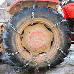 Huge tractor tyre with chains