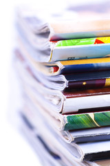 Stack of magazines isolated, close up