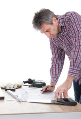 Worker looking into a house plan