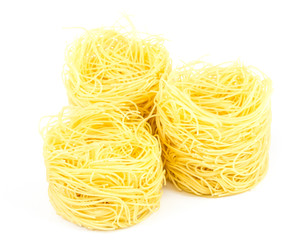 A portion of tagliatelle italian pasta isolated on white