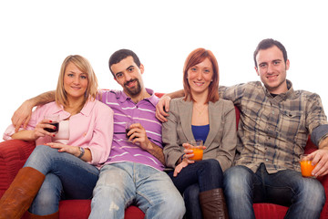 Young Group Sitting on Sofa and Drinking