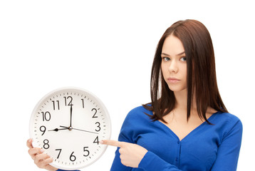 woman holding big clock