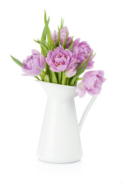 Pink tulips in metal pitcher