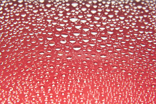 Water drops on glass red and white color
