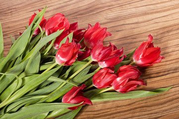 Beautiful bouquet of pink tulips lie on the table