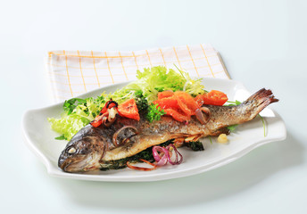 Baked trout with tomatoes and green salad