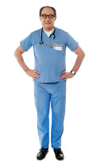 Full length view of smiling experienced medical professional
