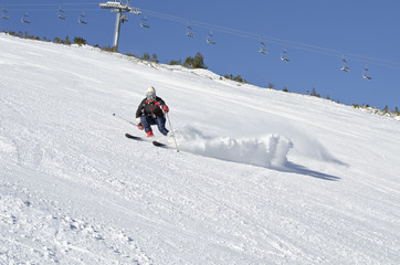 Fototapeta na wymiar Skier on the mountain side