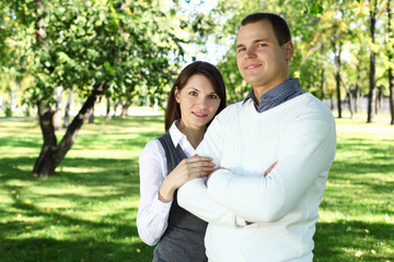 Young family with a child in summer park