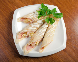 rolled pancakes stuffed ham and cheese.