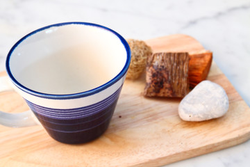 empty cup on chopping board