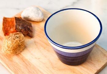 empty cup on chopping board