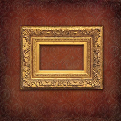 Vintage mockup, golden baroque frame on a red damask vintage texture