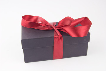 Gift box with a red bow and ribbon